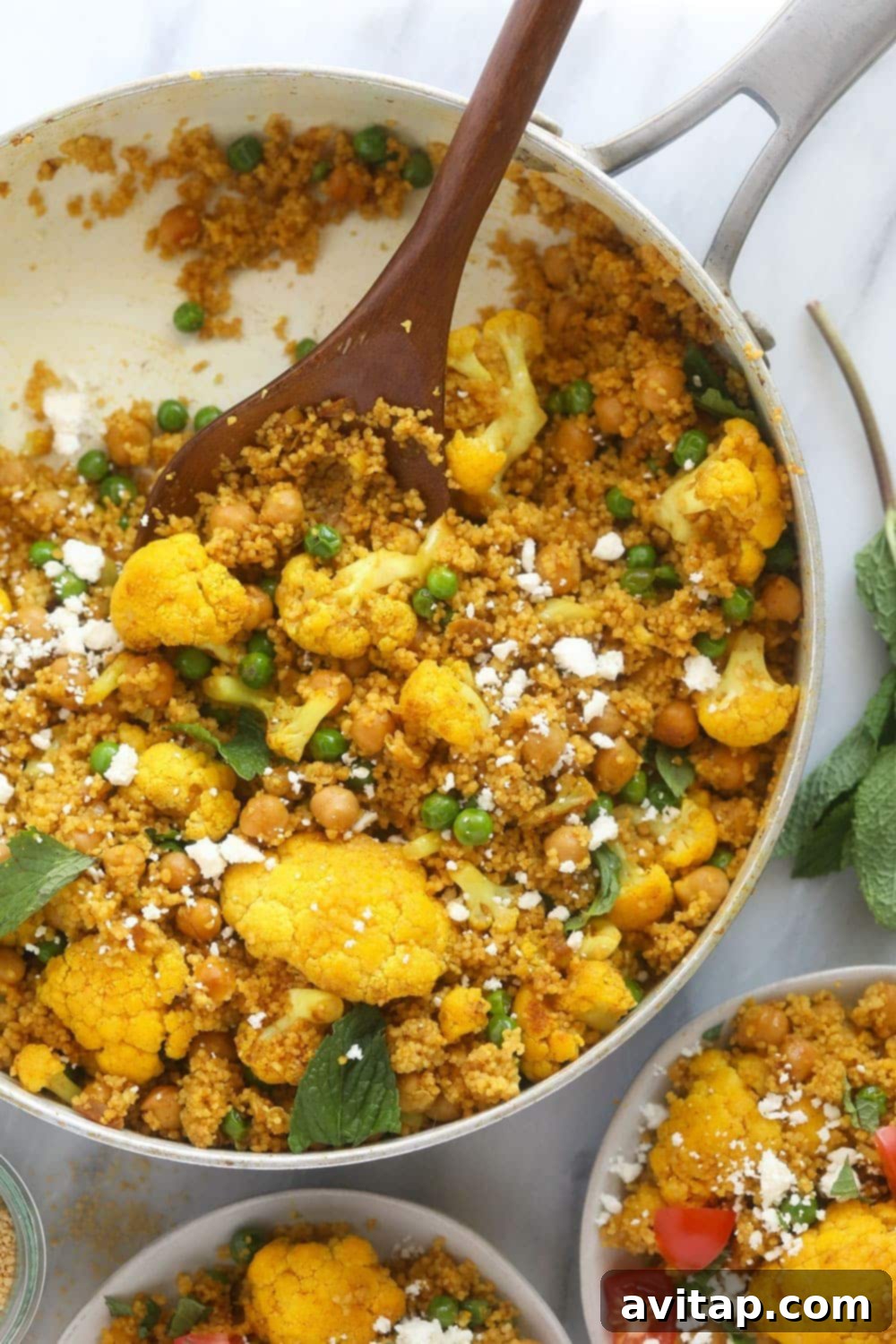Moroccan Chickpea Couscous: A healthy, anti-inflammatory, and freezer-friendly vegetarian meal. Moroccan Chickpea Couscous Skillet, brimming with vibrant vegetables and golden couscous, ready to be served