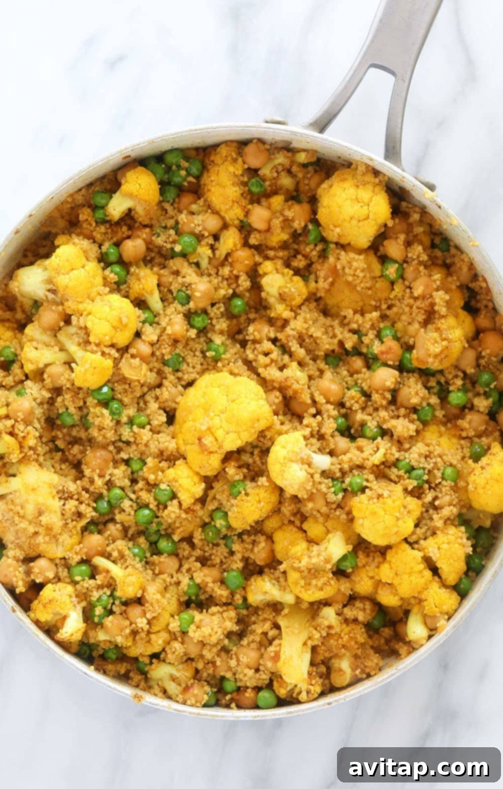 The finished Moroccan Chickpea Couscous Skillet, a healthy and delicious vegetarian dish. Moroccan Chickpea Couscous Skillet, perfectly cooked and garnished, ready for serving