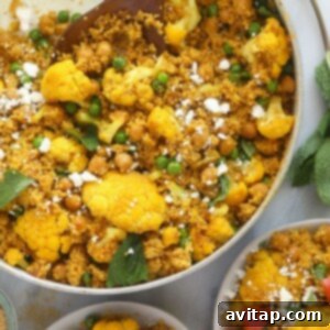 Moroccan Chickpea Couscous in a skillet, close-up shot.