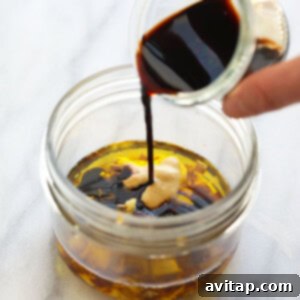 Homemade balsamic vinaigrette dressing in a clear jar.