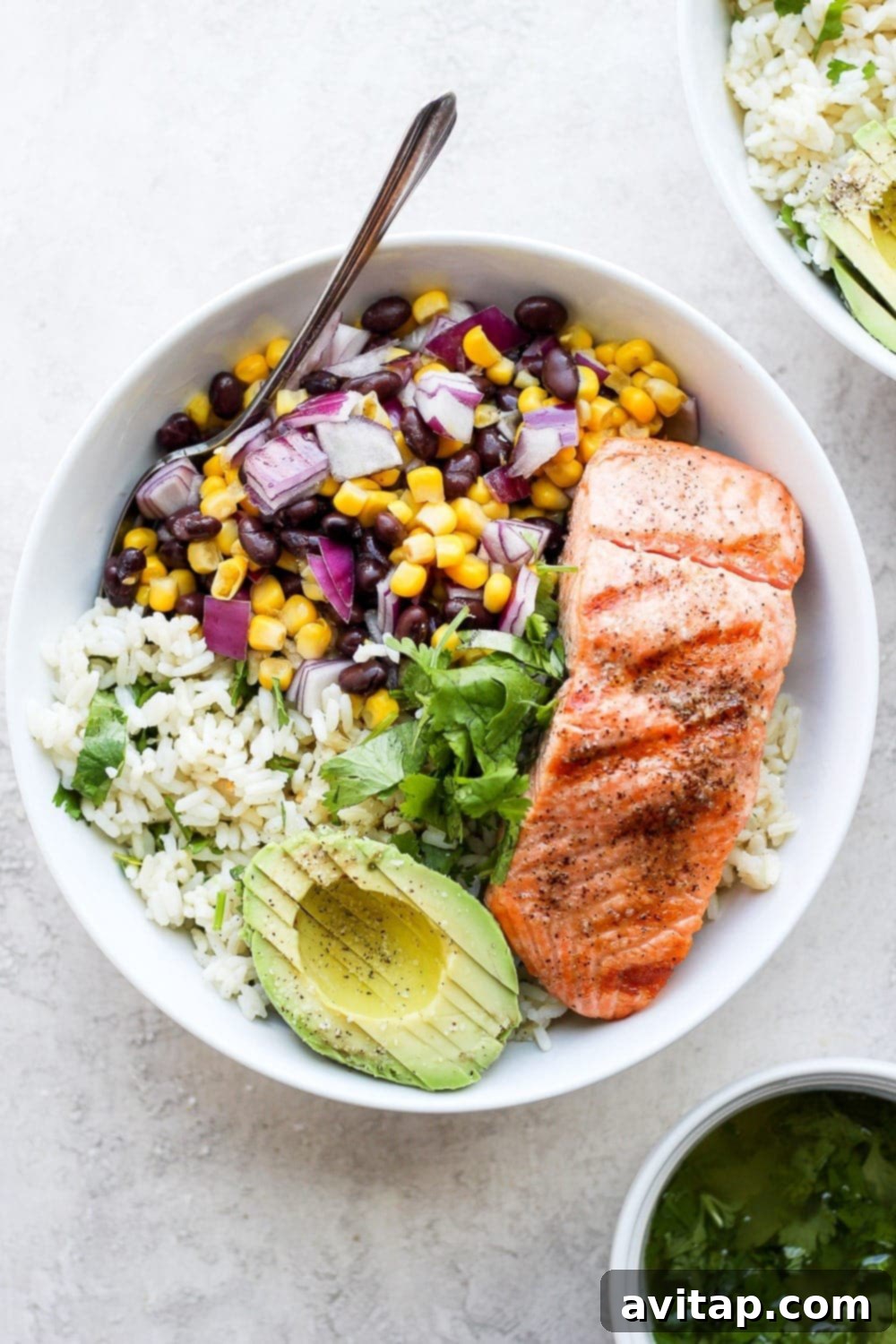 Zesty Salmon Power Bowls 2 fiesta salmon rice bowls with cilantro lime rice and corn and bean salsa