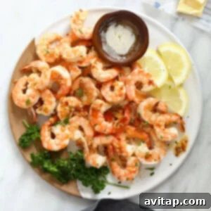 A vibrant dish of garlic butter shrimp on a plate, ready to be enjoyed.