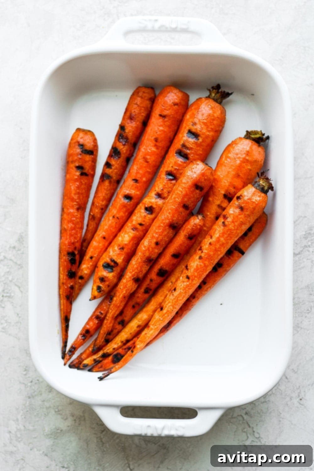 Grilled Carrots in a casserole dish, ready to be served as a perfect BBQ side