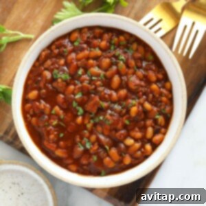 Easy Instant Pot Baked Beans 3 Cooked baked beans in a bowl, perfectly seasoned and ready to eat.