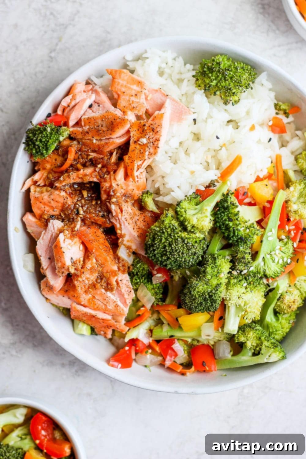 Sheet Pan Salmon Stir Fry served in a bowl with rice