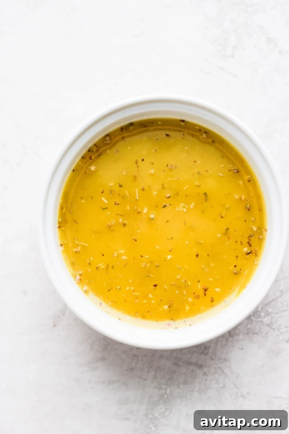Effortless Greek Chicken Marinade 5 Greek chicken marinade mixed thoroughly in a large bowl