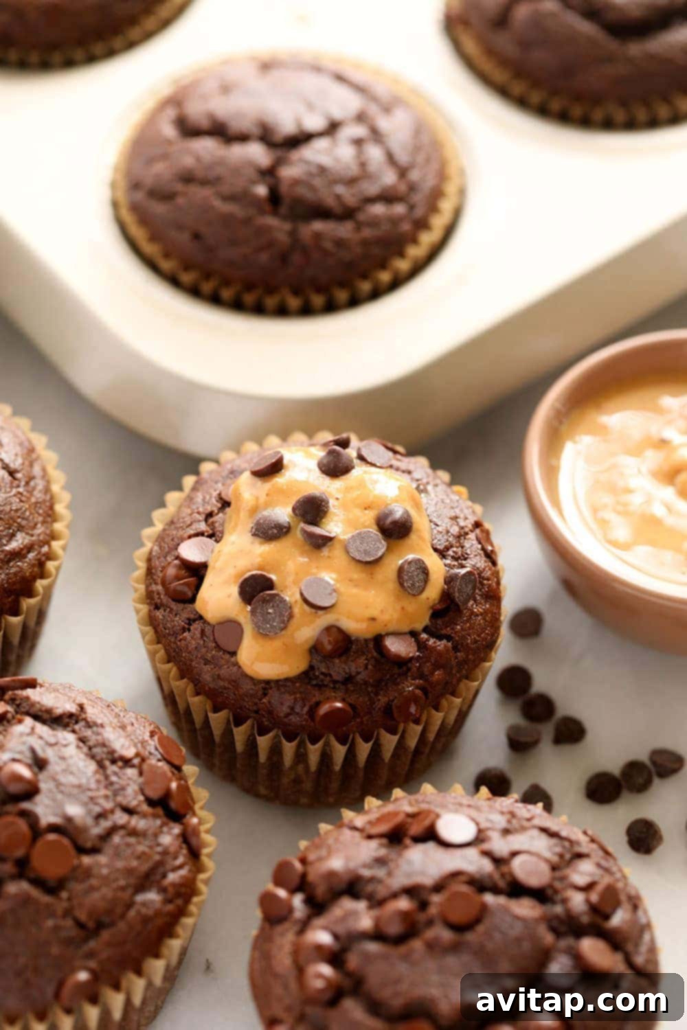 close up of healthy chocolate peanut butter muffins with chocolate chips