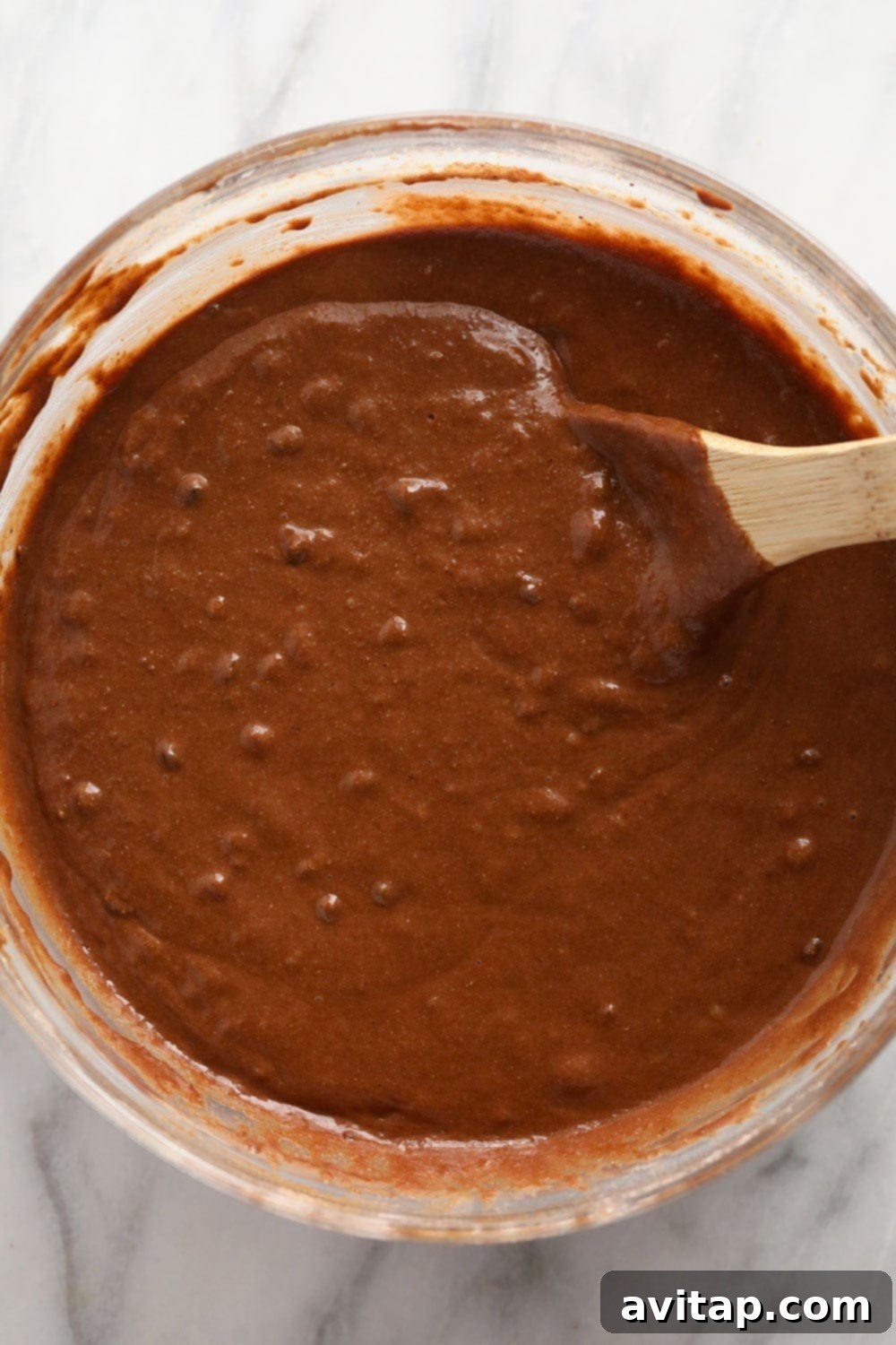 muffin batter with chocolate chips in a mixing bowl