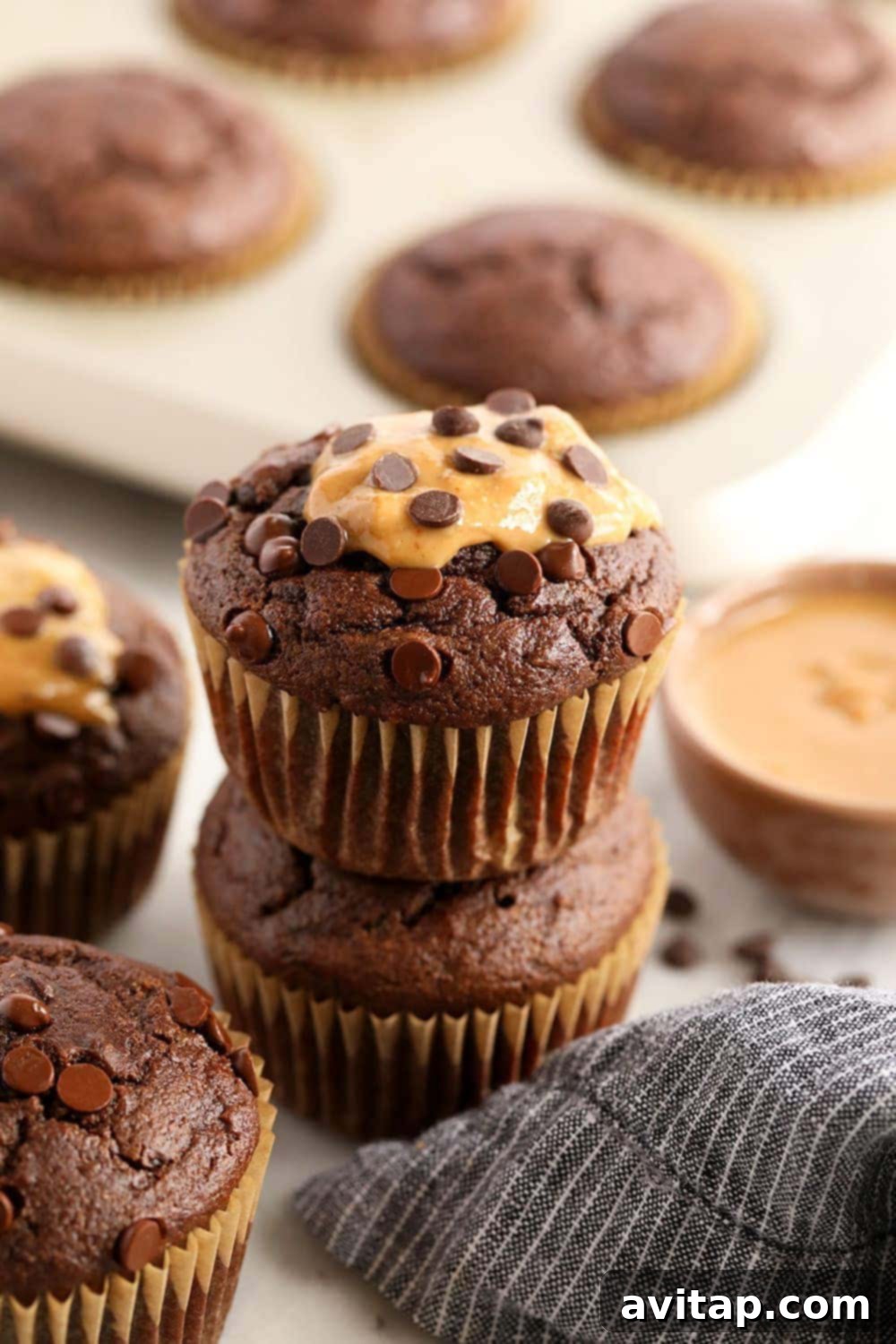 stack of healthy chocolate peanut butter muffins