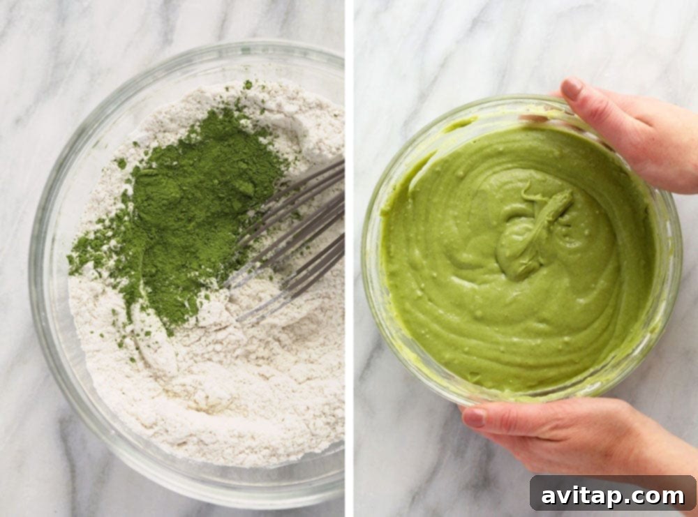Close-up of vibrant green matcha waffle batter in a mixing bowl, ready to be cooked.