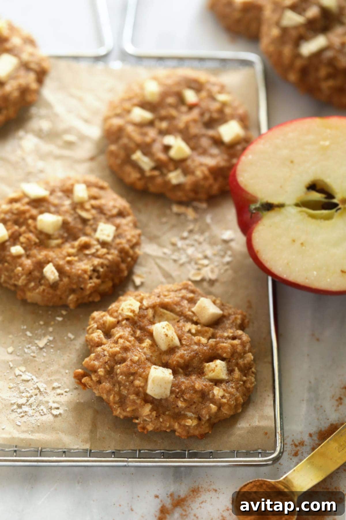 Soft and chewy apple oatmeal cookies cooling on a wire rack.