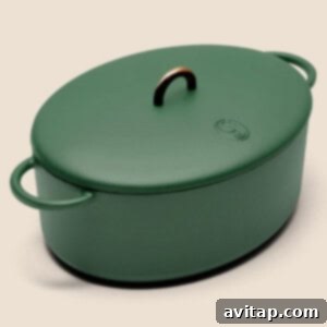 A stylish Dutch oven on a plain background, perfect for cooking hearty soups and one-pot meals.