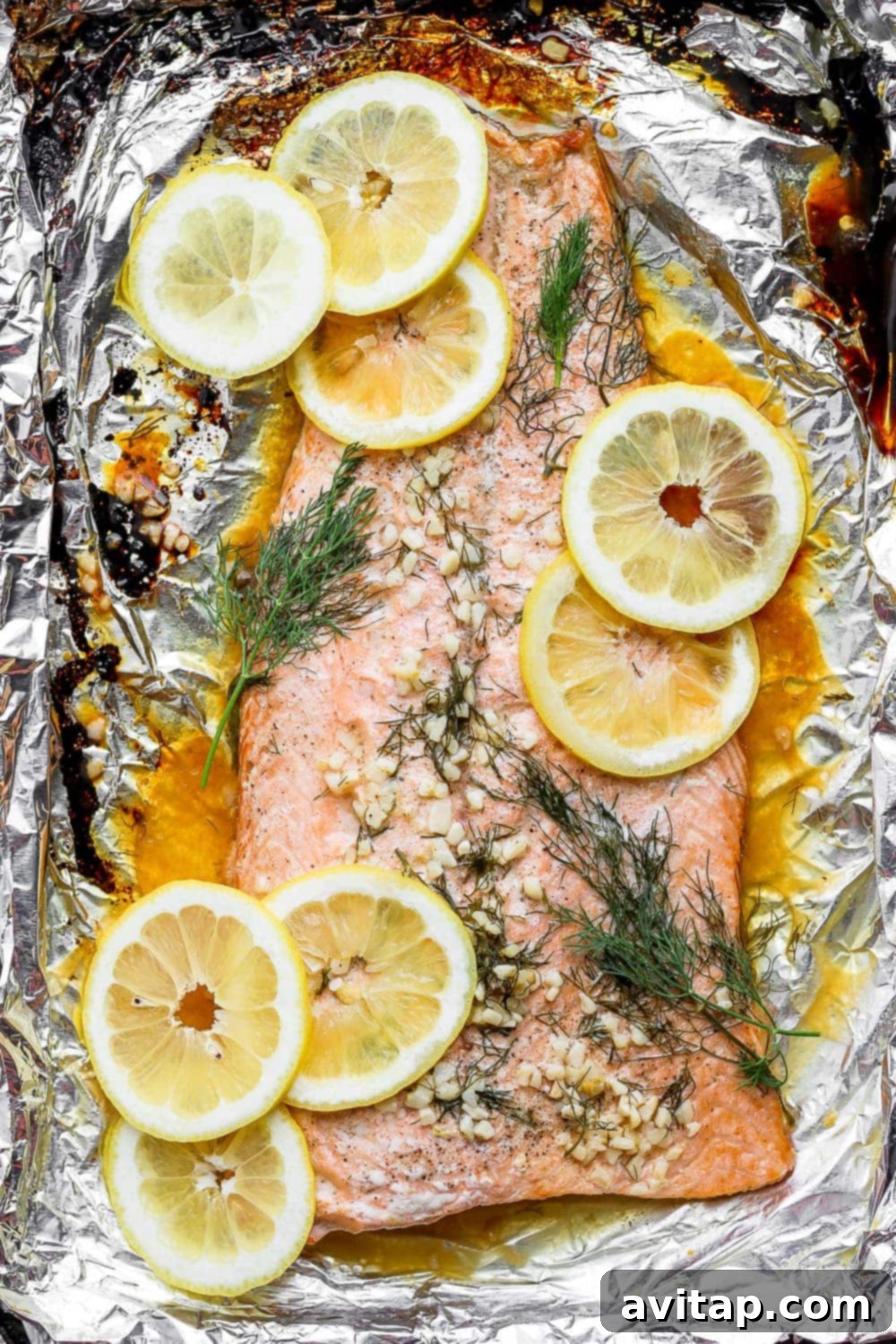 Baked salmon fillet on a baking sheet, ready to be served