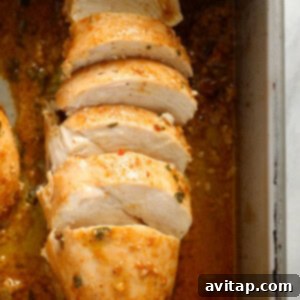 Chicken marinating in a pan, ready to be cooked.