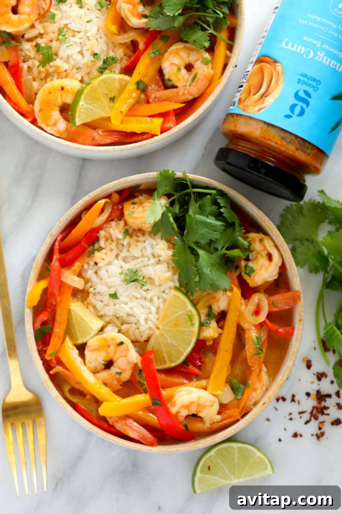 Quick and Creamy Panang Shrimp 2 A vibrant bowl of Shrimp Panang curry, ready to be enjoyed, garnished with fresh herbs.