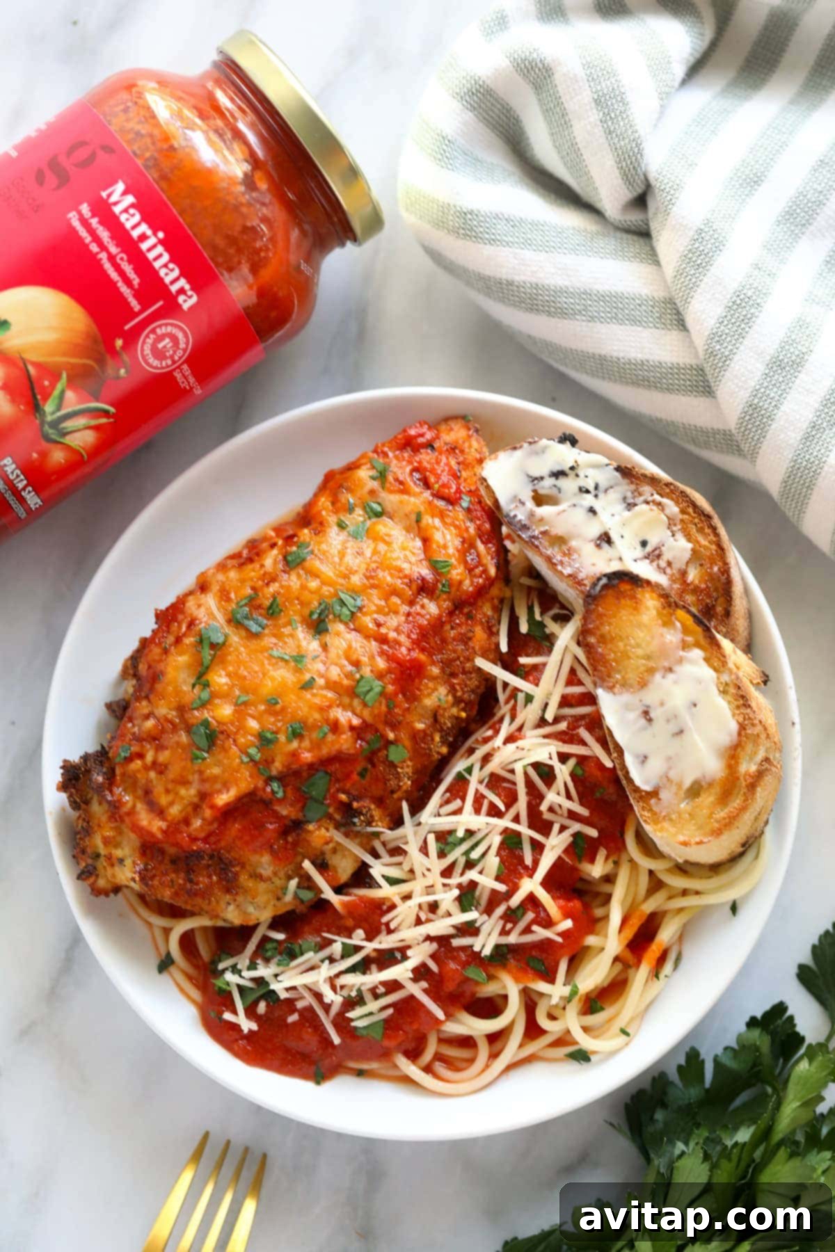 chicken parm on plate with marinara sauce