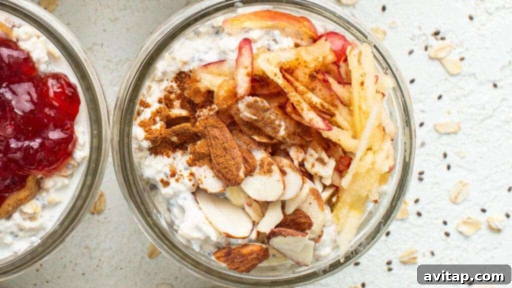 Three bowls of apple pie overnight oats, topped with shredded apple, cinnamon, and slivered almonds.