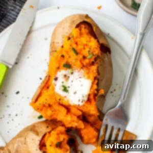 Sweet potatoes on a plate with a fork.