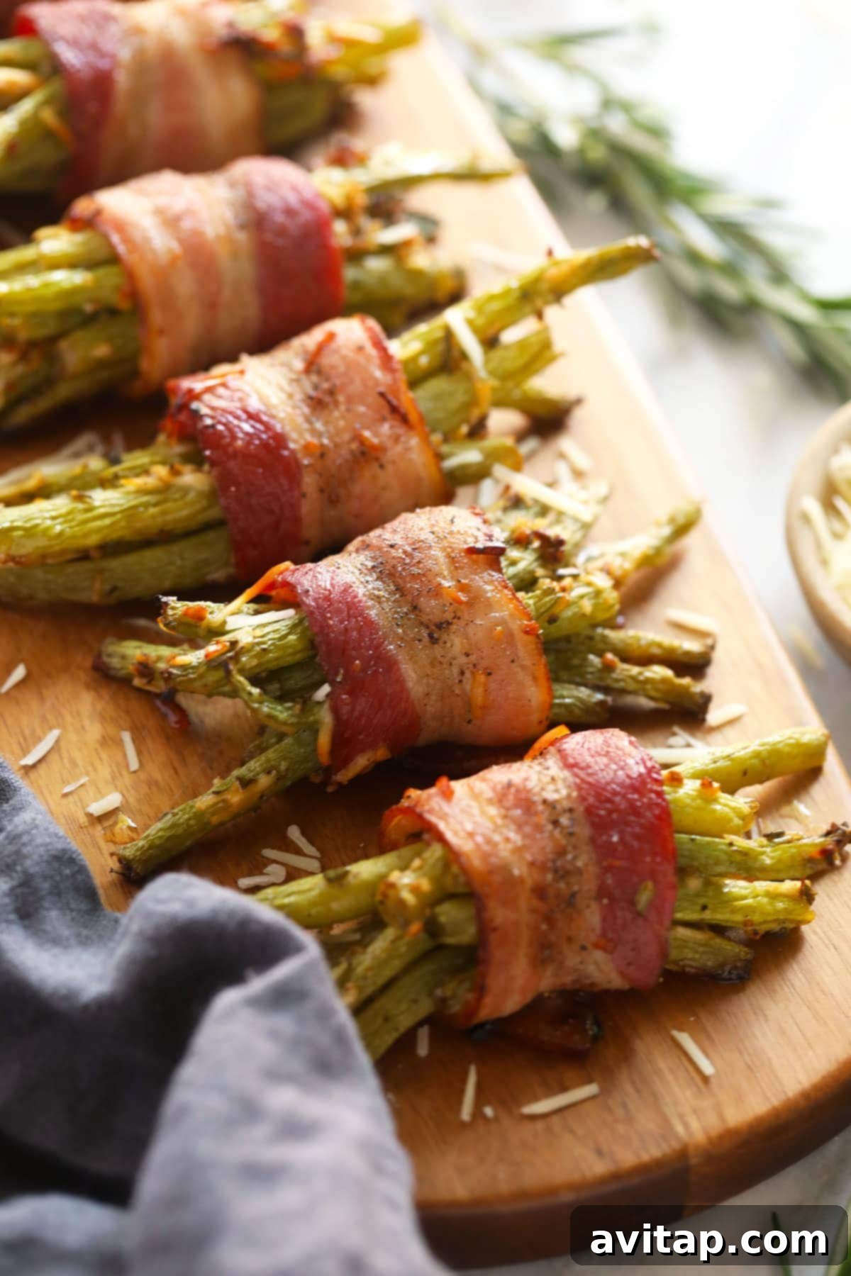 Perfectly baked bacon wrapped green beans, golden and ready to be served on a platter