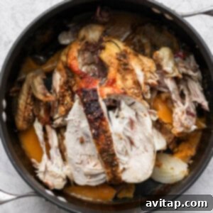 roasted chicken in a skillet on a white background.