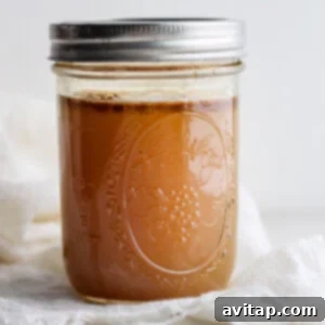 caramel sauce in a jar on a white cloth.