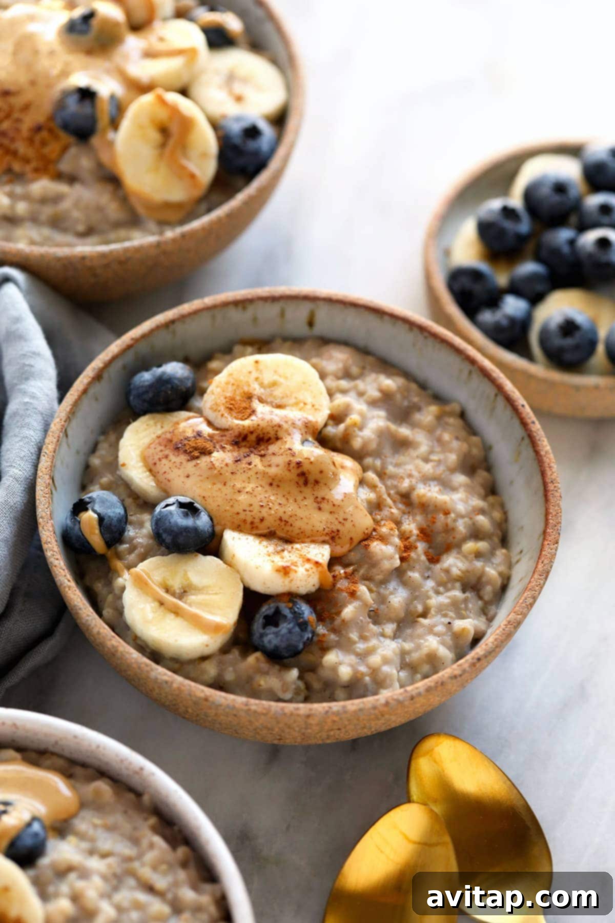 A bowl of creamy steel cut oats topped with fresh berries, showcasing their delicious bite and inviting appearance.