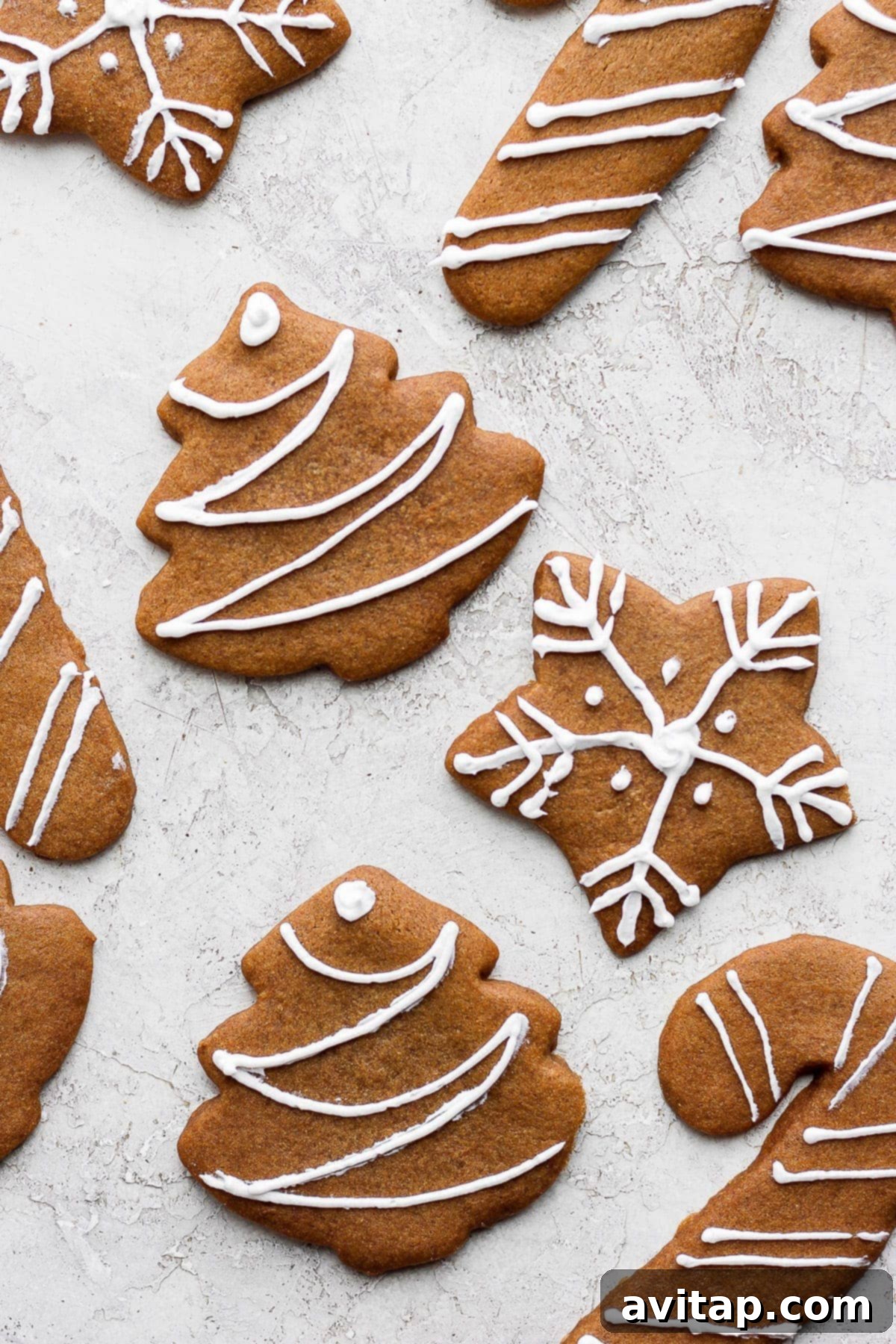 Beautifully decorated gingerbread cookies arranged on a kitchen counter, ready for holiday celebrations.