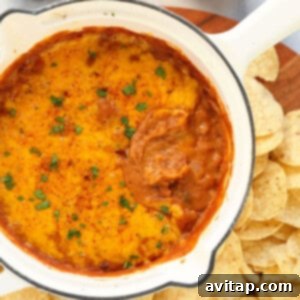 Bean dip in a baking dish with melted cheese