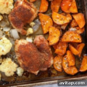 Sheet pan chicken and veggies, perfectly roasted and ready to eat.