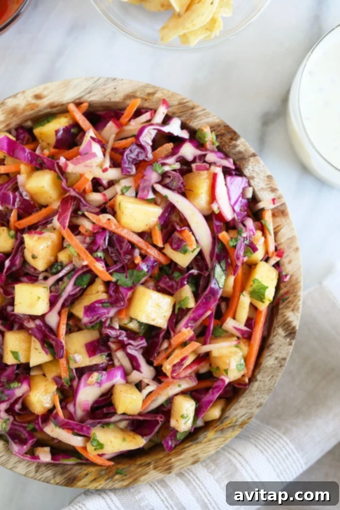 Delicious Pineapple Coleslaw in a rustic bowl, ready to serve