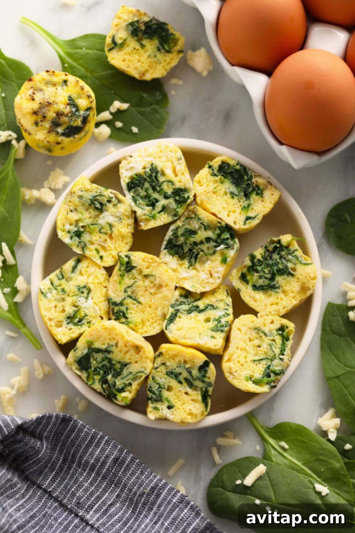 Fluffy Instant Pot Egg Bites 2 Instant Pot Egg Bites on a plate, ready to be enjoyed.