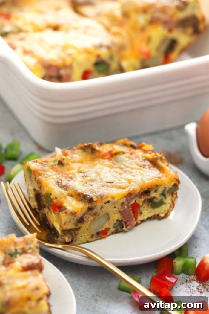 Delicious chicken fajita breakfast casserole served on a white plate, ready to eat