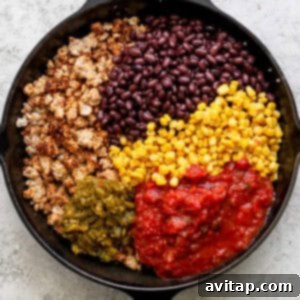 Fiesta-Filled Bell Peppers 10 Corn, black beans, green chilis, and salsa added to the meat mixture in the skillet.
