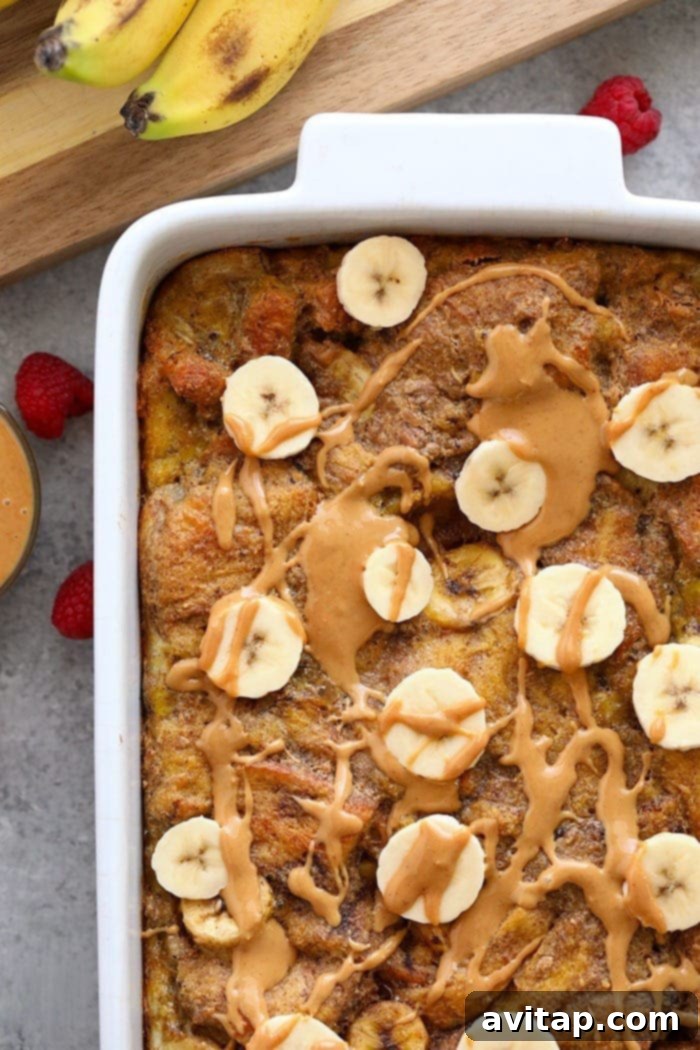 Close-up shot of the golden-brown baked French toast casserole with soft, custardy interior.