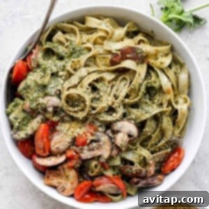 a bowl of vegan pesto pasta