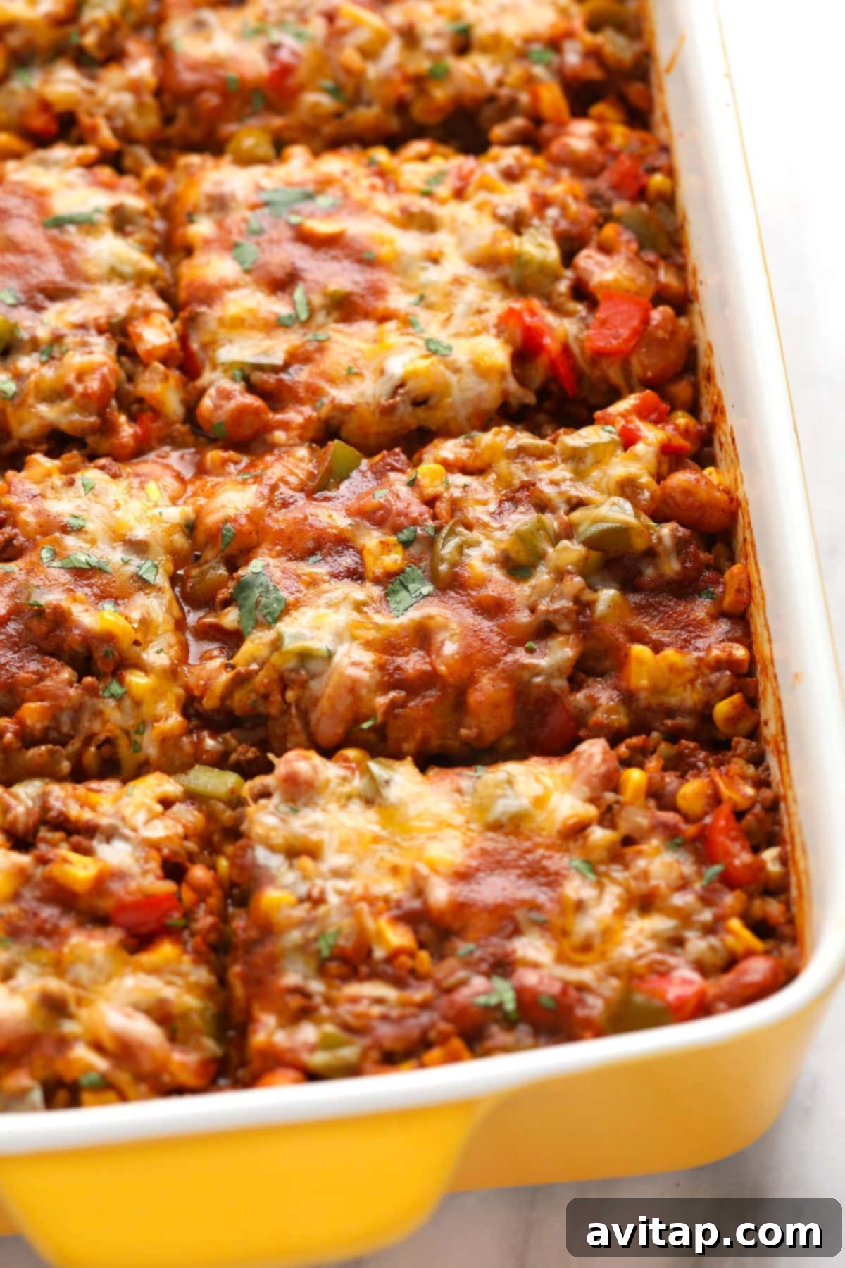 Baked Mexican casserole sliced into pieces.