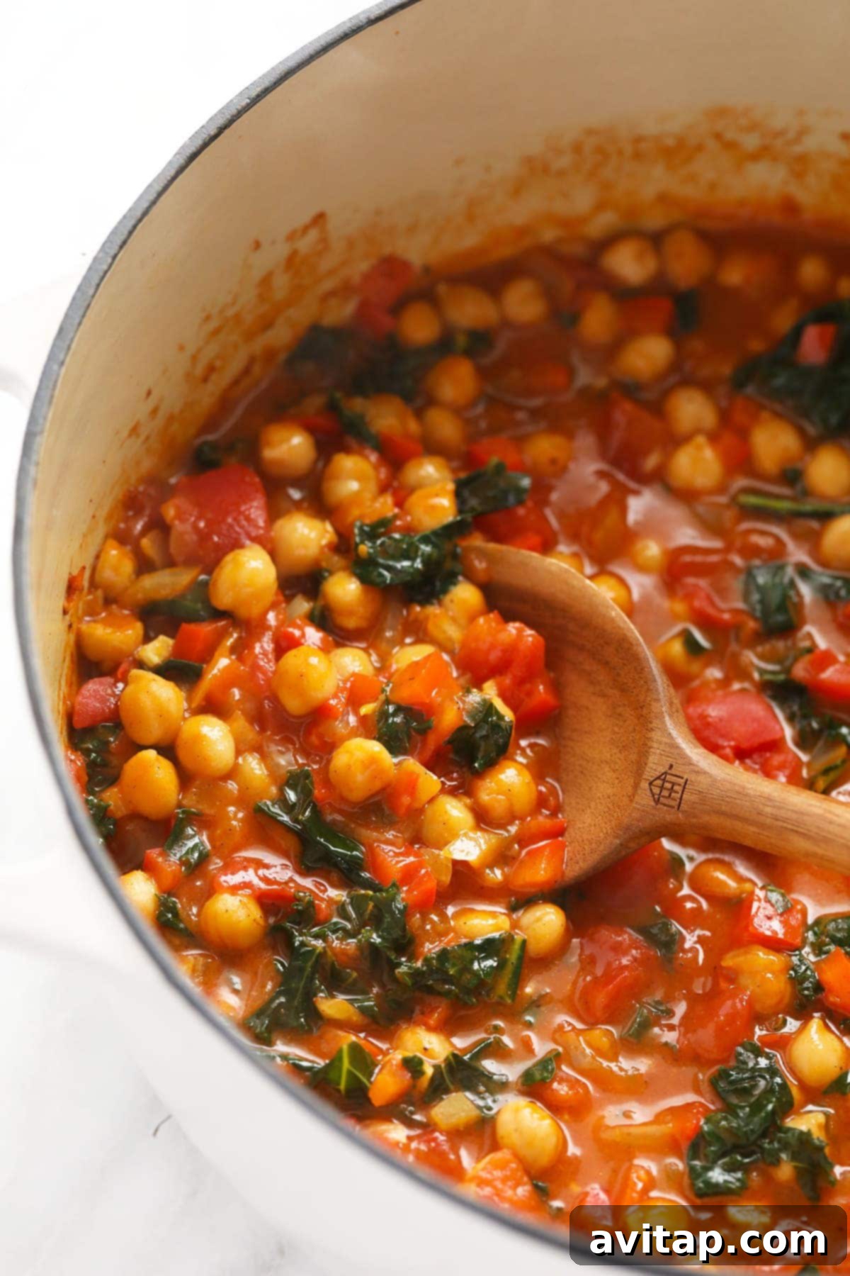 Chickpea Curry Ready to Serve A close-up view of the rich and flavorful chickpea curry in a large Dutch oven, ready to be portioned into individual serving bowls.
