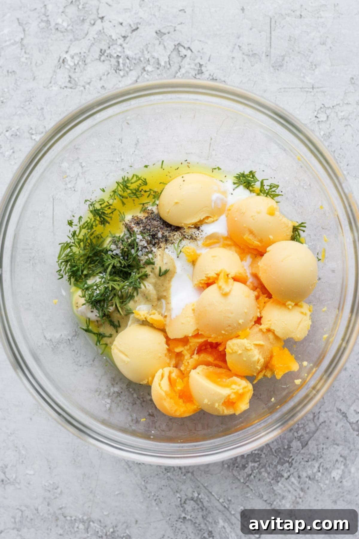 easy deviled egg filling ingredients in a bowl, ready to be mixed