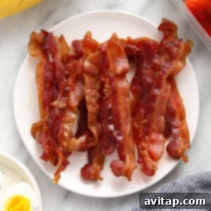 Crispy bacon on a plate, ready to be served.