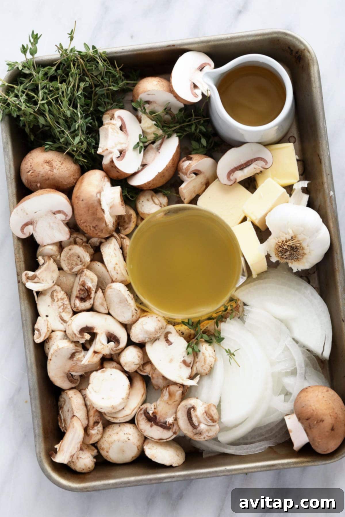 Fresh ingredients laid out on a cutting board, ready for making chicken marsala