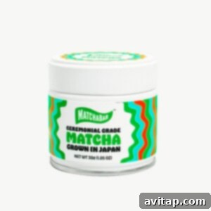 A tin of premium matcha powder, showcasing its vibrant green hue, essential for a perfect iced matcha latte.