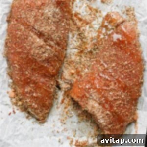 No-Fuss Roasted Turkey Tenderloin 4 Dry rub being applied to turkey tenderloin.