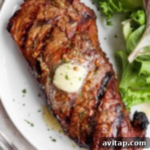 Marinated steak on a plate, ready for serving.