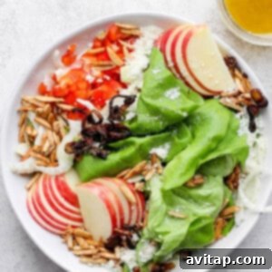 A bowl of fresh butter lettuce salad, ready to be served for dinner or lunch, showcasing its appealing colors and textures.