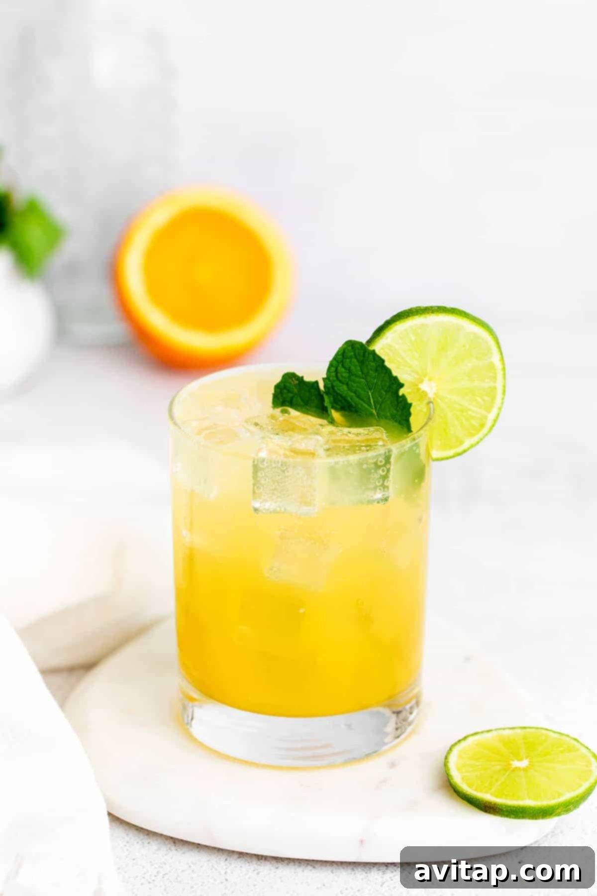 margarita with mint and a lime wedge.