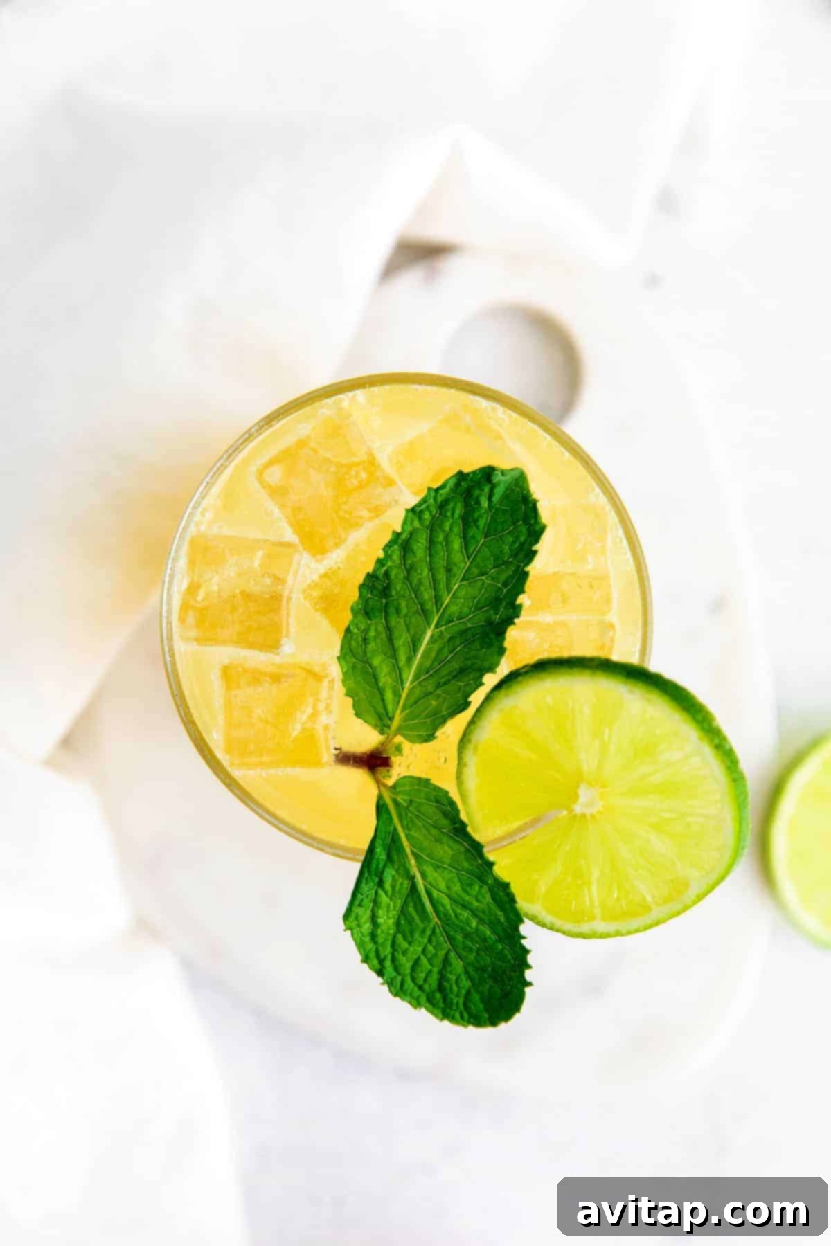glass full of margarita and a lime wedge.