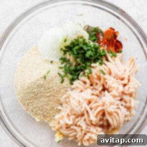 Burger ingredients in a bowl, prior to mixing with butter.