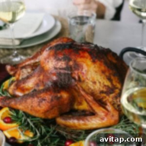 Slow-Smoked Whole Chicken 4 A beautifully smoked turkey, carved and displayed on a platter, ready to be served.
