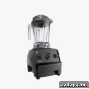 A sleek, modern high-speed blender on a clear background, ready for smoothie making.