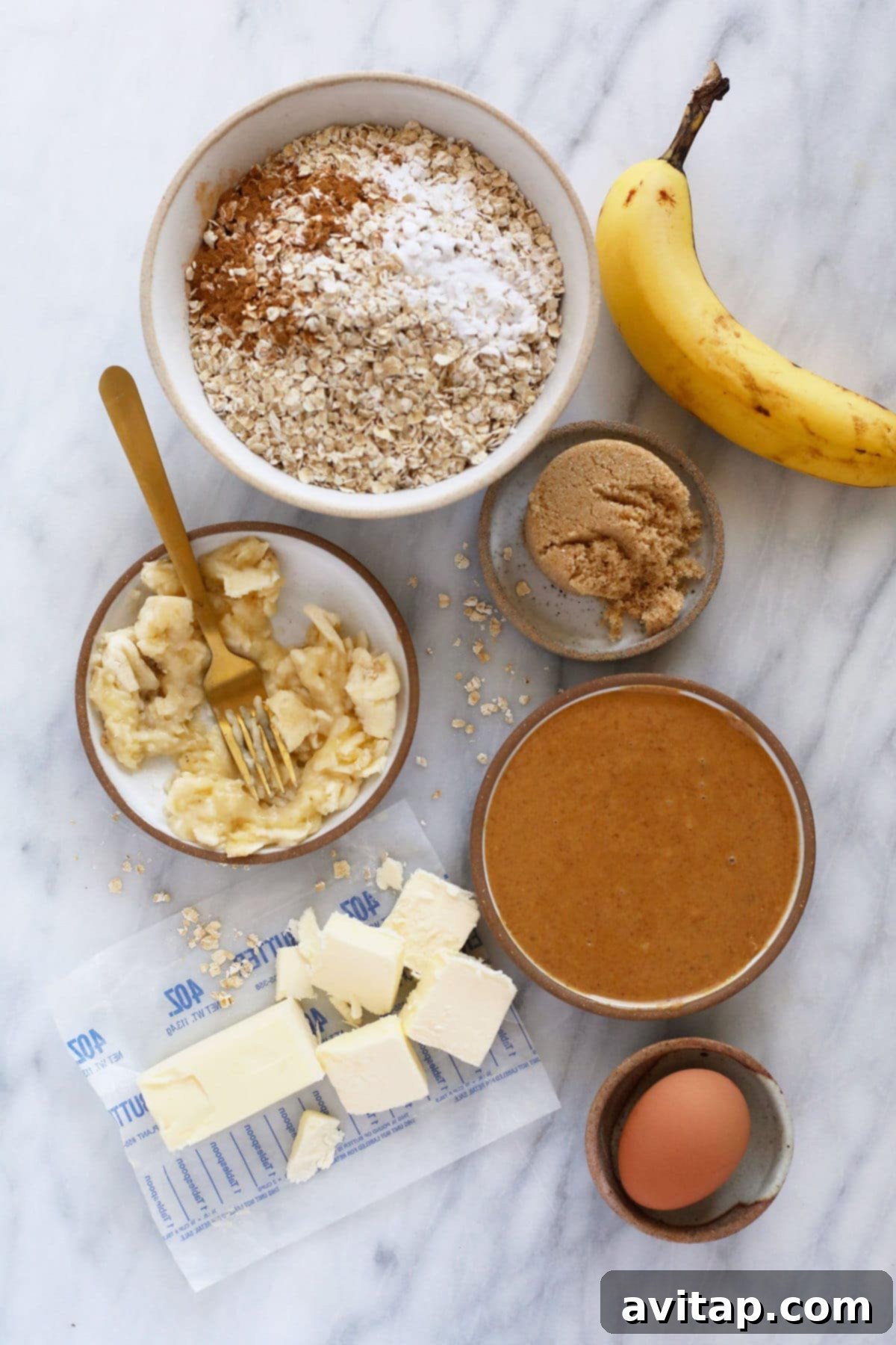 Arrangement of ingredients for Peanut Butter Banana Cookies on a kitchen countertop, ready for baking.